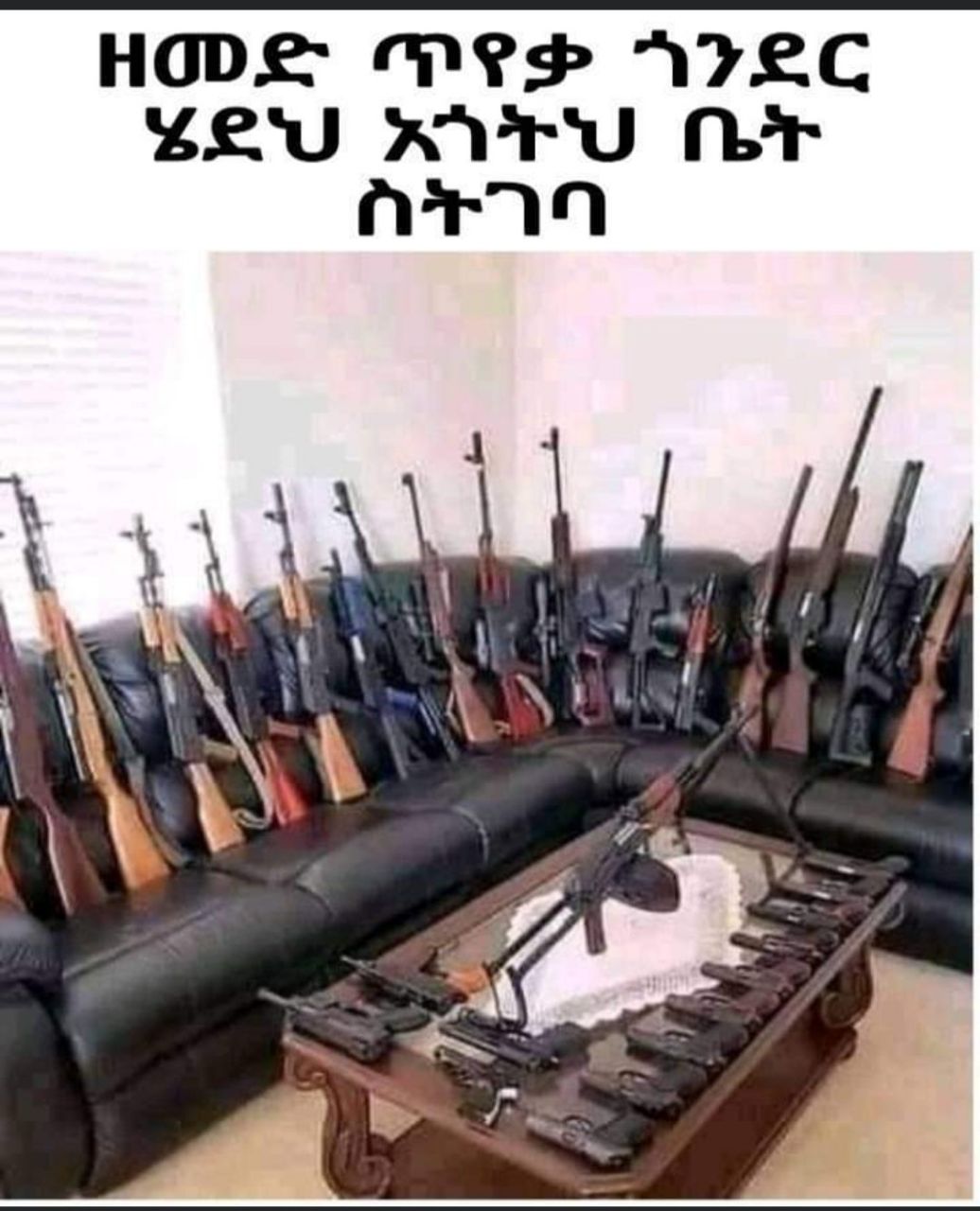 a couch with guns on it and a table with a gun